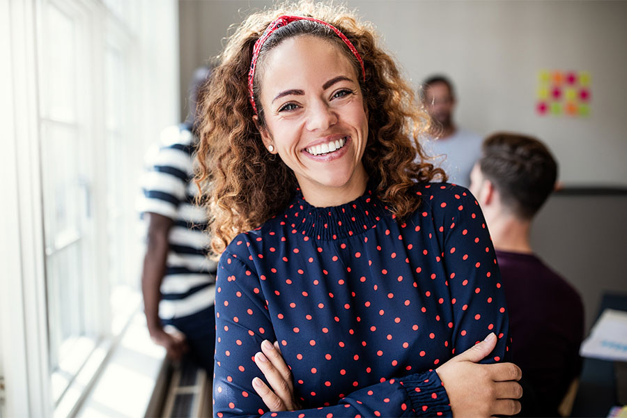 Smiling woman with polka dotted shirt